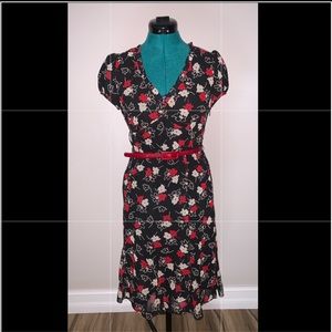 Black, v-neck dress with red and white flowers